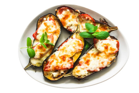 Eggplant baked with mozzarella cheese, tomatoes and basilの写真素材