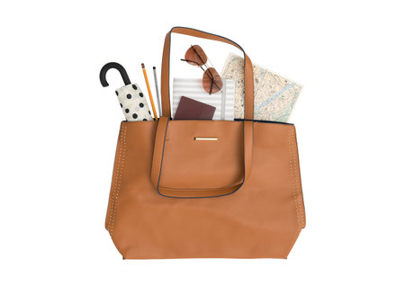 Brown leather bag with stationery on a white background. 3d rendering