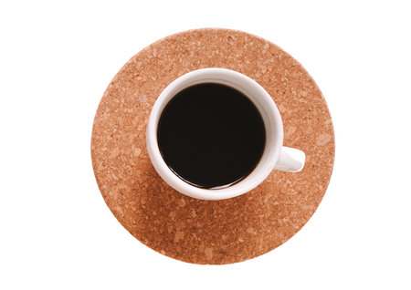 Cup of coffee on saucer on white background, top viewの写真素材