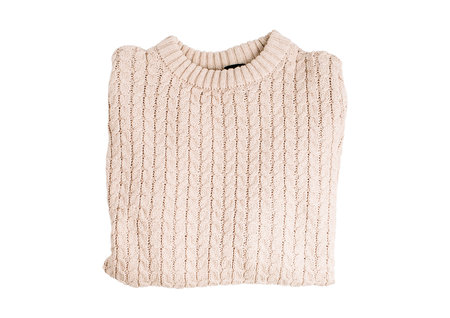 Warm beige knitted sweater isolated on a white background.の写真素材