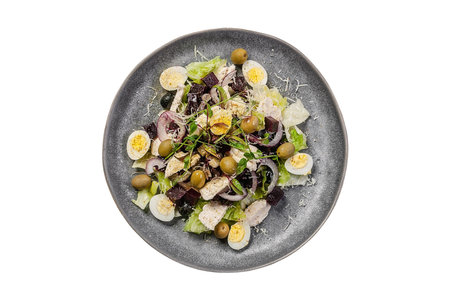 Plate of salad with chicken, quail eggs, olives and mayonnaiseの写真素材