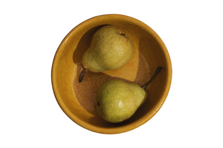 Ripe pears in a bowl isolated on a white background.の写真素材