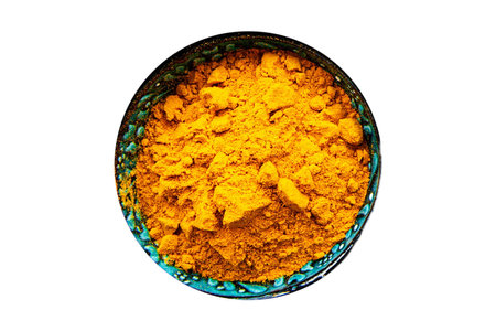 Turmeric powder in bowl isolated on white background. Top view.の写真素材
