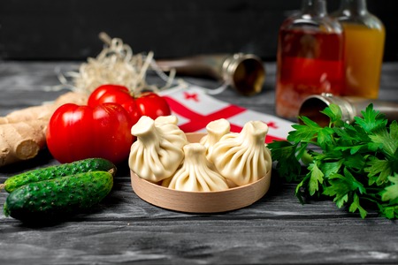 Above view of khinkali dumplings with coriander and satsebeli の写真素材