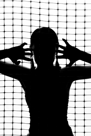 black silhouette of a girl on a white background.の写真素材