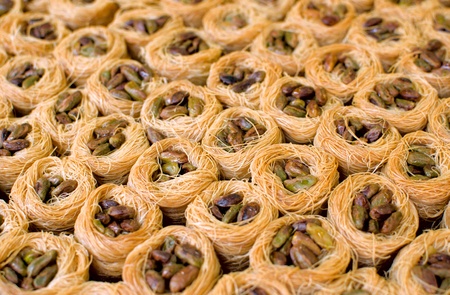 Close of many oriental sweets with pistacheの写真素材