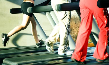 People - only legs to be seen - on the treadmill (intense colors)