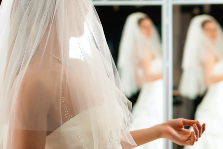 Bride at the clothes shop for wedding dressesの写真素材