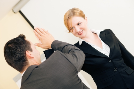 Two people in Business giving each other a high five for a successful transactionの写真素材