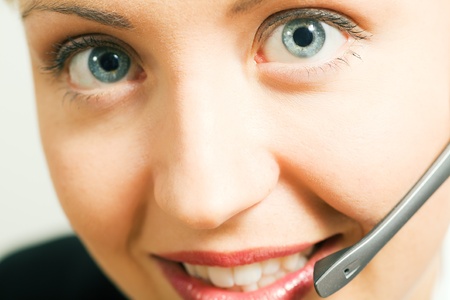 Portrait of a friendly female call center operatorの写真素材