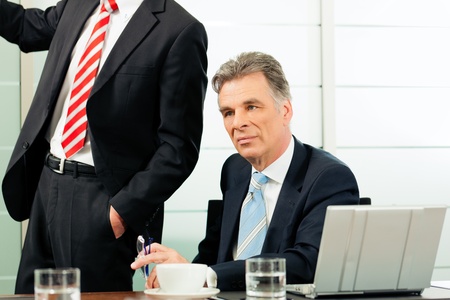 Senior Manager or boss in meeting contemplating new strategyの写真素材