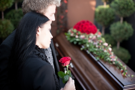 Religion, death and dolor  - funeral and cemetery; funeral with coffinの写真素材