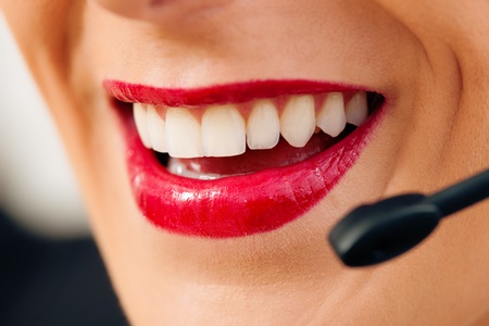 Portrait of a friendly female call center operatorの写真素材