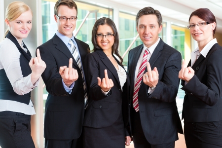 Business - group of businesspeople posing for group photo in office Business - group of businesspeople posing for group photo in office