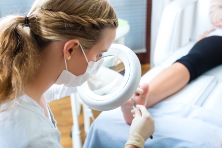 Woman receiving podiatry treatment in a Day Spa Woman receiving podiatry treatment in a Day Spa