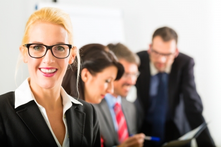 Business - businesspeople have a meeting with presentation in office, they negotiate a contract - Portrait of a businesswomanの写真素材