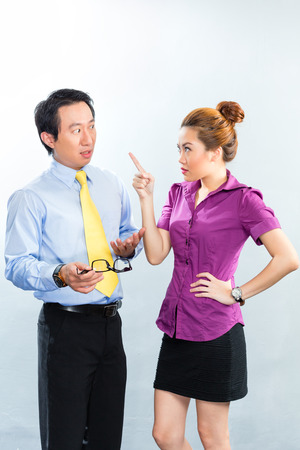 crisis or bullying under colleagues or boss and employee at the officeの写真素材