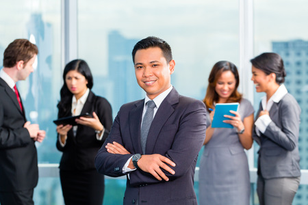 Portrait of Asian business man with team colleaguesの写真素材