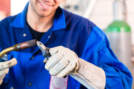 Welder inflame welding device in metal workshopの写真素材