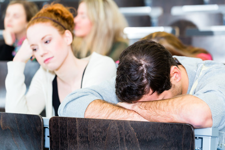 Overworked college students being tiredの写真素材