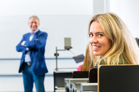 Students listening to college professor giving lecture