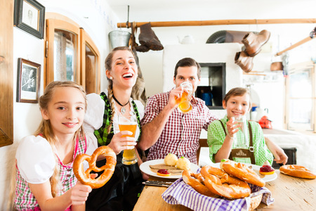 Bavarian family having traditional meal in German restaurantの写真素材