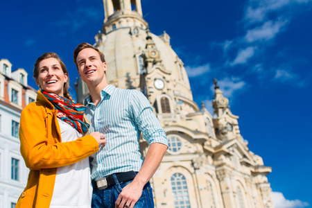 Tourism - couple of man and women at Frauenkirche in Dresdenの写真素材