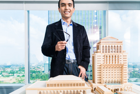 Indian architect in office with architecture modelの写真素材