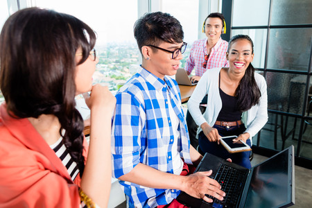 College students working together in group on campus