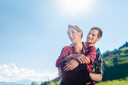 Man and woman hiking the alp mountainsの写真素材