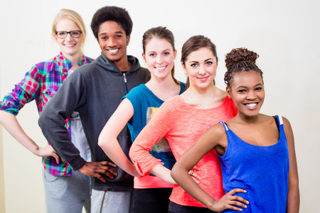 Group of young people having dance lessons