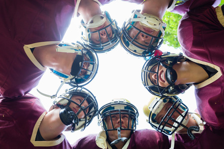 American Football Team having huddle in matchの写真素材