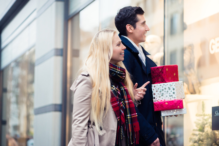 Woman and man Christmas shoppingの写真素材