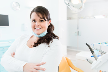 Dentist or nurse standing in dental surgeryの写真素材