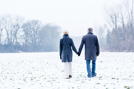 Senior couple having winter walkの写真素材