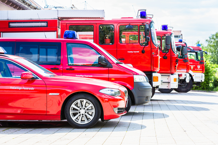 Car pool with fire engines of fire department
