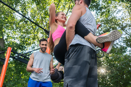 Low-angle view of a young fit woman smiling while doing crunches for advanced with her strong...