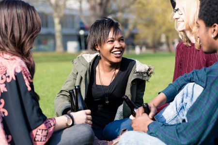 Portrait of a girl sitting with her friends in the garden