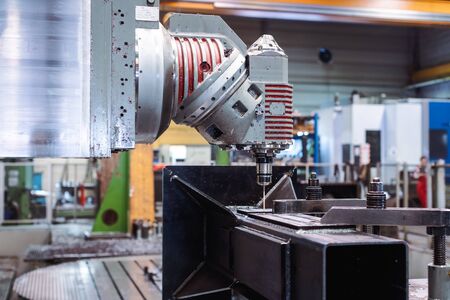 Milling machine robot working on metal workpieceの写真素材
