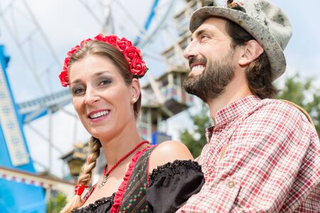 Man and woman in Bavarian Tracht on the Oktoberfest in Munichの写真素材