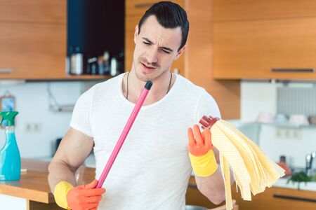Man is a bit overwhelmed by the duties of a homemaker not knowing what to do