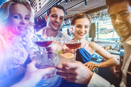 Four friends in a fancy bar
