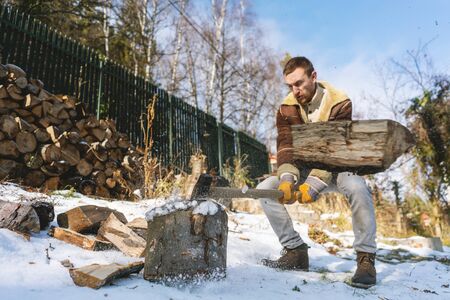 Man chopping wood with an axe, pieces and debris flying around, dynamic action scene