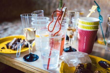 Lots of waste and trash after a party, mostly disposable cups