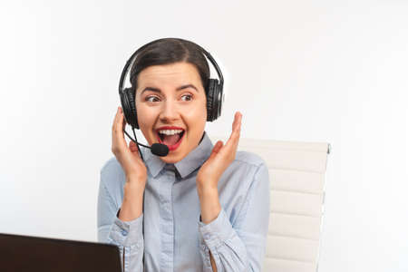 Front view of a surprised businesswoman wearing headphone