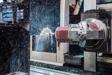 Industrial milling machine robot working on workpieceの写真素材
