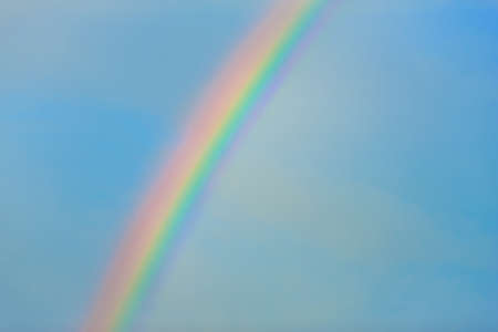 Rainbow in clear blue skyの写真素材