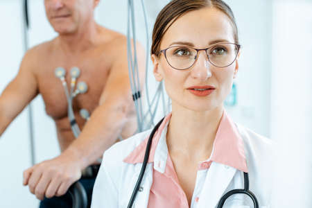 Doctor and patient during stress or exercise ecgの写真素材