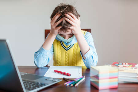 Pupil in despair because schools are still closed due to virusの写真素材