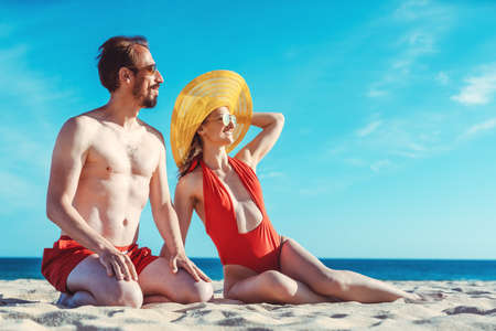 Middle aged couple in their summer vacation on the beachの写真素材